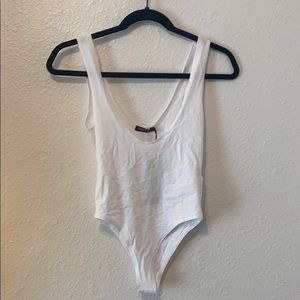 Low cut white body suit